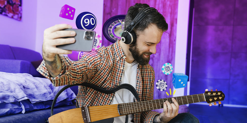Hombre tocando su guitarra mientras piensa en PlayUZU y sus slots favoritos.